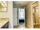 Neutral bathroom featuring a granite countertop and a walk-in shower, providing a sleek and comfortable space at 9156 Wedge Dr, Davenport, FL 33896