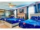 This stylish bedroom has a cool space theme with custom decorations that is sure to impress at 9156 Wedge Dr, Davenport, FL 33896