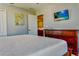 Bedroom with TV, grey walls and red chair at 9156 Wedge Dr, Davenport, FL 33896