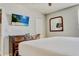 Bedroom featuring TV, mounted mirror and dresser at 9156 Wedge Dr, Davenport, FL 33896