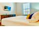 Bedroom with TV, dresser and neutral decor at 9156 Wedge Dr, Davenport, FL 33896
