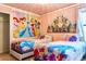 The bedroom features twin beds and a delightful Disney princess-themed decor at 9156 Wedge Dr, Davenport, FL 33896