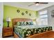 Bright bedroom featuring a tropical theme and a ceiling fan at 9156 Wedge Dr, Davenport, FL 33896