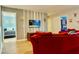 Cozy living room with a large sofa, wall-mounted TV, and stylish decor accents at 9156 Wedge Dr, Davenport, FL 33896