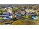 Aerial view of a home with a private, screened pool, well-maintained landscaping and fenced yard at 621 Avocado St, St Cloud, FL 34769