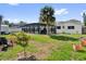 Lush backyard with a fenced pool area, perfect for outdoor enjoyment and privacy at 621 Avocado St, St Cloud, FL 34769