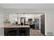 Open kitchen layout with stainless steel appliances and a breakfast bar perfect for casual dining at 621 Avocado St, St Cloud, FL 34769