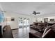 Spacious living room with sliding glass doors leading to the outdoor pool area at 621 Avocado St, St Cloud, FL 34769