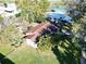 Aerial view of the home showcasing the property's lush surroundings and proximity to the water at 10 Massachusetts Ave, St Cloud, FL 34769
