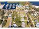 Expansive aerial view showcasing the neighborhood, waterfront marina, and nearby community park at 10 Massachusetts Ave, St Cloud, FL 34769