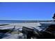 Relaxing beach view featuring a volleyball net and bench, perfect for recreation at 10 Massachusetts Ave, St Cloud, FL 34769