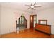 Bright bedroom with hardwood floors, direct access to sunroom, and ample natural light, providing a comfortable retreat at 10 Massachusetts Ave, St Cloud, FL 34769