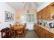 Dining room with seating for four people and natural light at 10 Massachusetts Ave, St Cloud, FL 34769