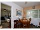 Dining room with seating for four people and natural light at 10 Massachusetts Ave, St Cloud, FL 34769