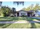 Charming single-story home featuring a well-manicured lawn and mature landscaping, offering great curb appeal at 10 Massachusetts Ave, St Cloud, FL 34769