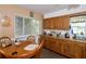 Eat-in kitchen featuring wood cabinets and ample counter space at 10 Massachusetts Ave, St Cloud, FL 34769
