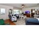 Inviting living room with a view to the front yard and kitchen at 10 Massachusetts Ave, St Cloud, FL 34769