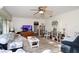 Bright living room with a ceiling fan and access to the kitchen at 10 Massachusetts Ave, St Cloud, FL 34769