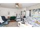 Living room with a ceiling fan and view of the front yard at 10 Massachusetts Ave, St Cloud, FL 34769