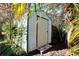 Convenient backyard shed for extra storage, surrounded by greenery at 10 Massachusetts Ave, St Cloud, FL 34769