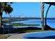 Picturesque waterfront scene with benches and clear blue waters at 10 Massachusetts Ave, St Cloud, FL 34769