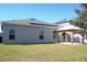 Home exterior with solar panels, a gazebo, and a green lawn at 1228 Haines Dr, Winter Haven, FL 33881