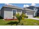 Well-maintained home exterior showcasing a manicured lawn and lush landscaping at 1228 Haines Dr, Winter Haven, FL 33881