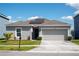 Charming single Gathering home with well-maintained lawn and solar panels on the roof at 1228 Haines Dr, Winter Haven, FL 33881