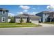 Charming single-Gathering home featuring a manicured lawn and a two-car garage at 1228 Haines Dr, Winter Haven, FL 33881