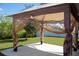 Backyard gazebo with netting, offering a relaxing outdoor space at 1228 Haines Dr, Winter Haven, FL 33881