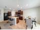 Kitchen and dining area featuring an island with bar seating, modern appliances, and ample cabinet space at 1228 Haines Dr, Winter Haven, FL 33881