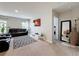 Spacious living room with modern decor, a mounted TV, comfortable seating, and natural light at 1228 Haines Dr, Winter Haven, FL 33881