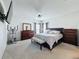 Serene main bedroom with a king-size bed, ample closet space, and a calming atmosphere at 1228 Haines Dr, Winter Haven, FL 33881