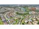 Expansive aerial view of Solivita community showcasing lush landscaping, serene ponds, and the amenity complex at 1264 Bonita Canyon Dr, Kissimmee, FL 34759