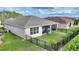 Aerial view of the fenced backyard with screened lanai at 1264 Bonita Canyon Dr, Kissimmee, FL 34759