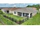 Aerial view of the fenced backyard with screened lanai at 1264 Bonita Canyon Dr, Kissimmee, FL 34759