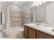 Well-lit bathroom with shower-tub combo and modern vanity at 1264 Bonita Canyon Dr, Kissimmee, FL 34759