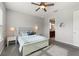 Bedroom with carpet, ceiling fan, and a view of the attached bathroom at 1264 Bonita Canyon Dr, Kissimmee, FL 34759
