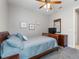 Bedroom with carpet, ceiling fan, and a dresser at 1264 Bonita Canyon Dr, Kissimmee, FL 34759