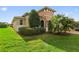 Well-maintained lawn and landscaping complement this charming home with a neutral exterior at 1264 Bonita Canyon Dr, Kissimmee, FL 34759