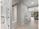 Bright hallway with white trim and tiled floor leads to open living spaces at 1264 Bonita Canyon Dr, Kissimmee, FL 34759