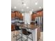 Open kitchen with granite countertops, stainless steel appliances, and pendant lighting at 1264 Bonita Canyon Dr, Kissimmee, FL 34759
