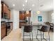 Modern kitchen with stainless steel appliances, island seating, and stylish pendant lights at 1264 Bonita Canyon Dr, Kissimmee, FL 34759