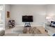 Comfortable living room featuring tile floors, modern furnishings and neutral color palette at 1264 Bonita Canyon Dr, Kissimmee, FL 34759