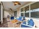 Inviting screened patio featuring comfortable seating and a ceiling fan, perfect for outdoor relaxation and entertaining at 1264 Bonita Canyon Dr, Kissimmee, FL 34759