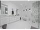 Bright bathroom with double vanity, soaking tub, and marble-accented walk-in shower at 13049 Sunshine Cir, Clermont, FL 34711