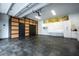 Spacious garage with built-in storage cabinets and slat wall system for organized storage and convenience at 13049 Sunshine Cir, Clermont, FL 34711