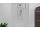 Bright hallway with white walls, recessed lighting, and tile flooring at 13049 Sunshine Cir, Clermont, FL 34711