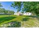 Expansive backyard featuring a storage shed and well-maintained lawn at 1418 Delaware Ave, St Cloud, FL 34769