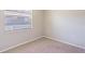 Cozy bedroom with plush carpeting and a large window for natural light at 1418 Delaware Ave, St Cloud, FL 34769